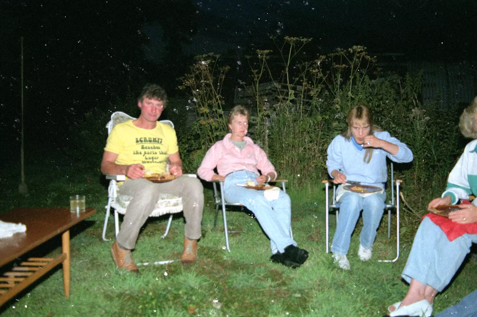 Geoff looks up from his sausages, from Sue's Fire Dance, Stuston, Suffolk - 21st July 1990