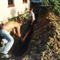 Fitting a length of pipe into a ditch