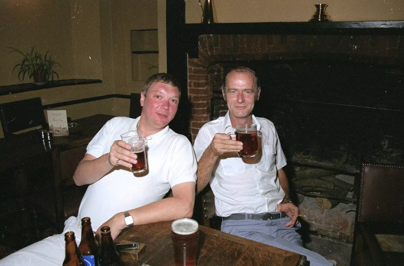 Bill Hartley and Kiwi raise a glass, from Stuston Sewerage and Kate's Printec Birthday, Scole Inn, Norfolk and Suffolk - 2nd August 1990