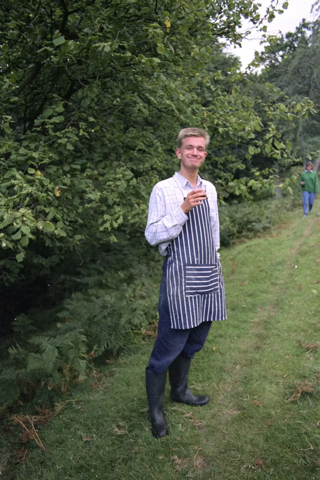 Nosher in a kitchen apron and wellies, from Liz's Party, Abergavenny, Monmouthshire, Wales - 4th August 1990