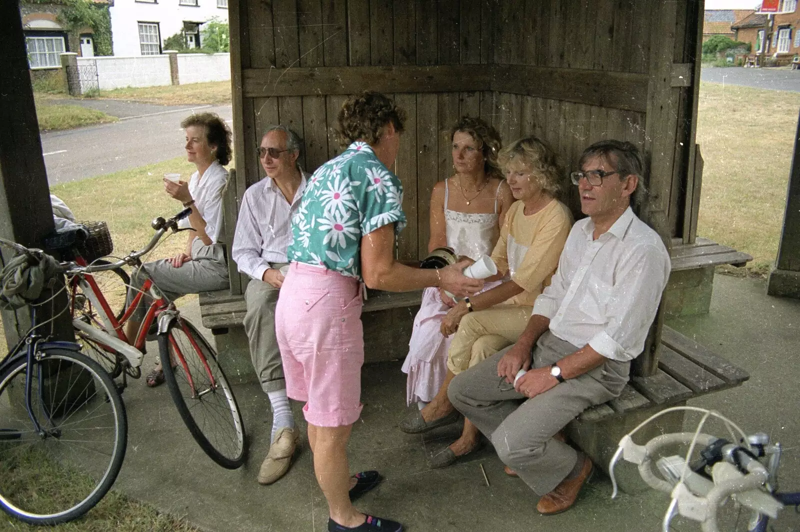 Brenda passes around some cider, from A Bike Ride to Redgrave, Suffolk - 11th August 1990