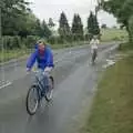 Linda peddles past, A Bike Ride to Redgrave, Suffolk - 11th August 1990