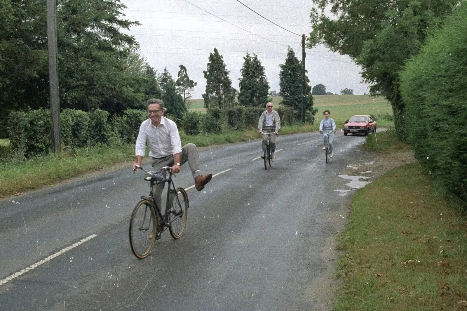 Derek goes for a bit of bicycle acrobatics, from A Bike Ride to Redgrave, Suffolk - 11th August 1990