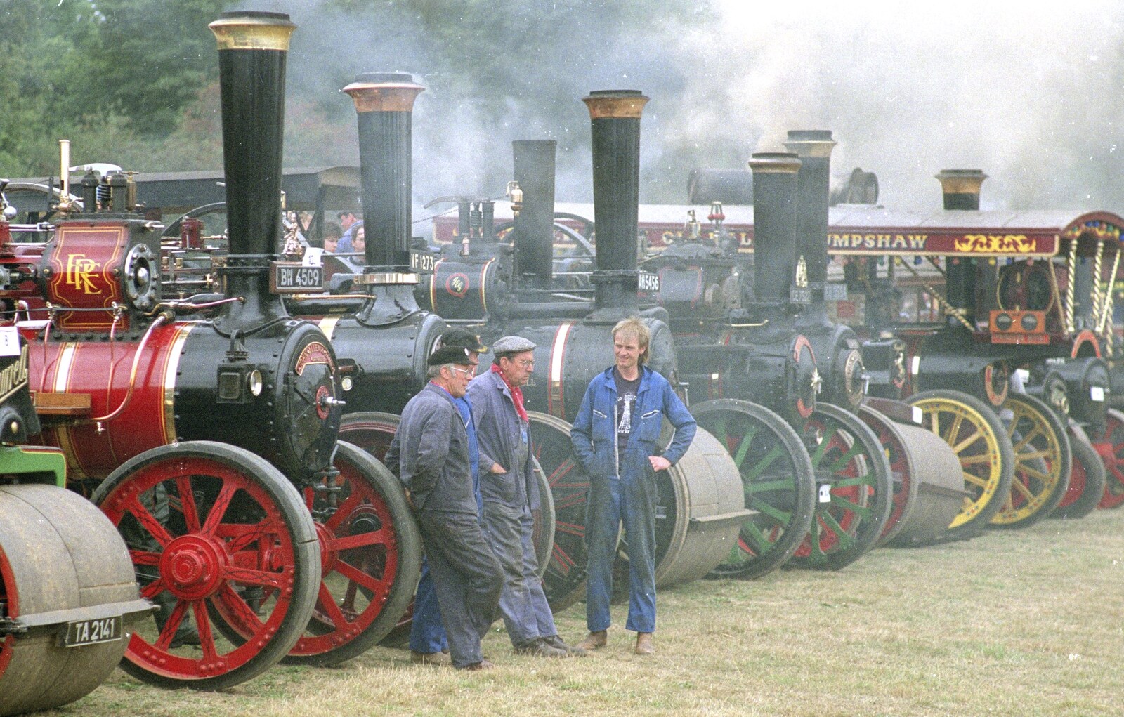 Blokes in boiler suits chat next to engines from The Henham Steam Fair, Henham, Suffolk - 19th September 1990