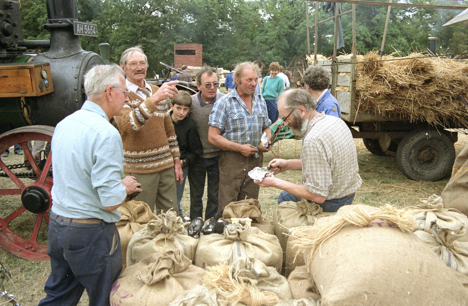 There's some activity over sacks of wheat from The Henham Steam Fair, Henham, Suffolk - 19th September 1990