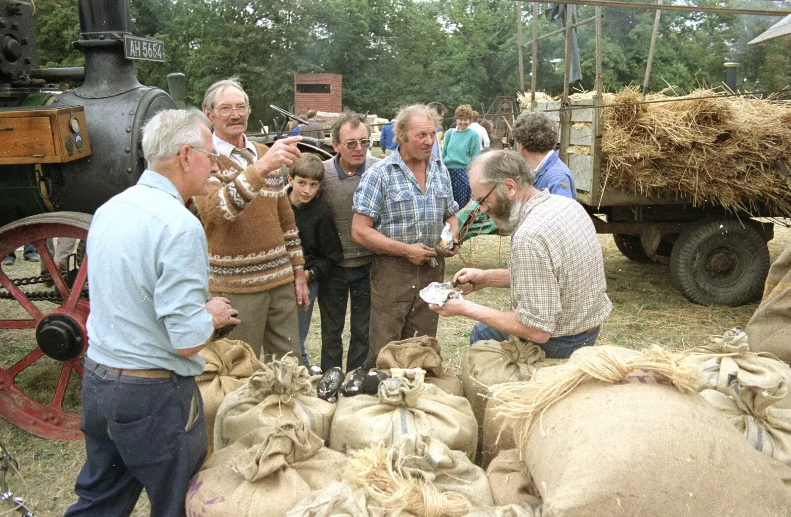 There's some activity over sacks of wheat, from The Henham Steam Fair, Henham, Suffolk - 19th September 1990