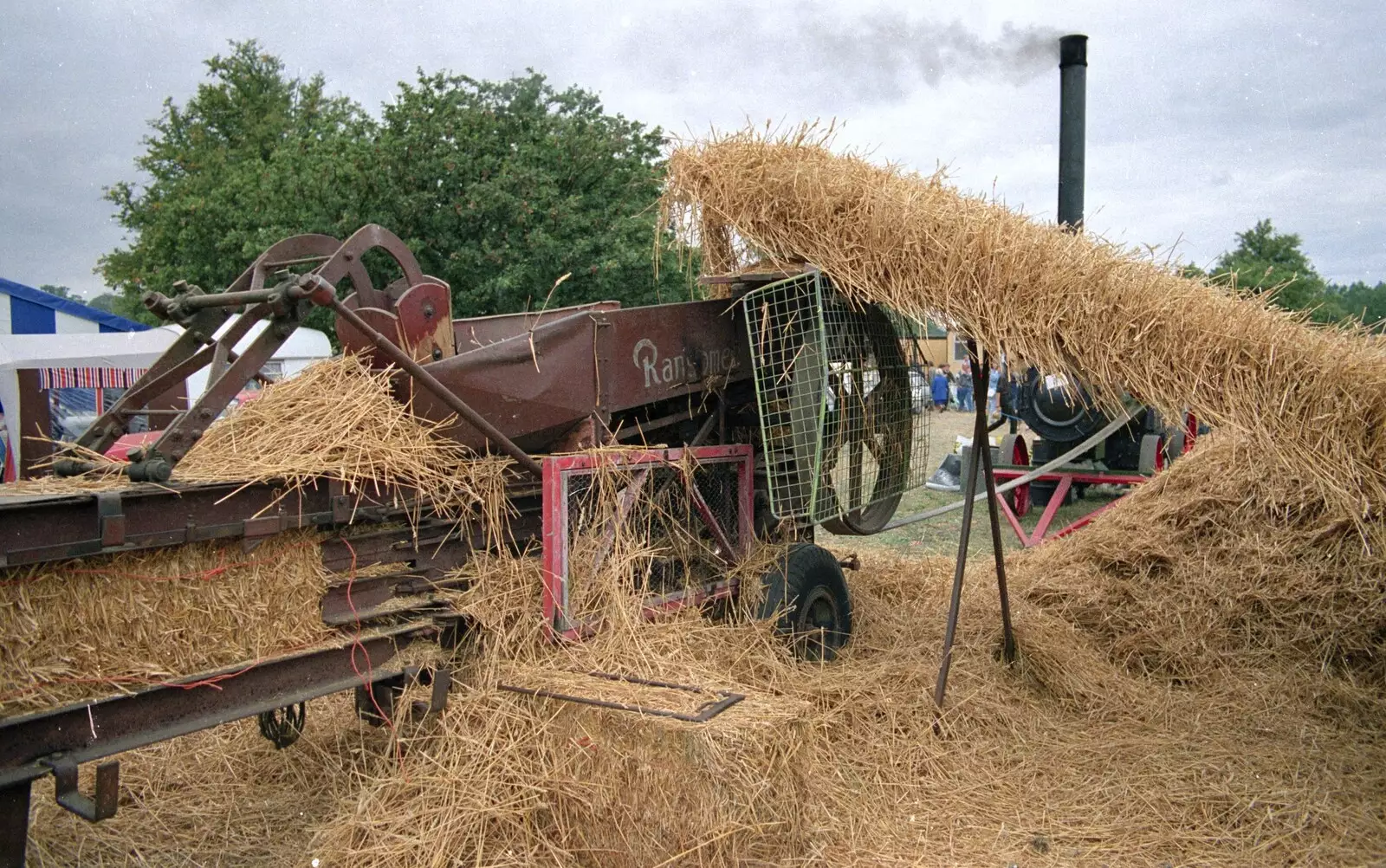 A conveyor belt takes wheat up to the thresher, from The Henham Steam Fair, Henham, Suffolk - 19th September 1990