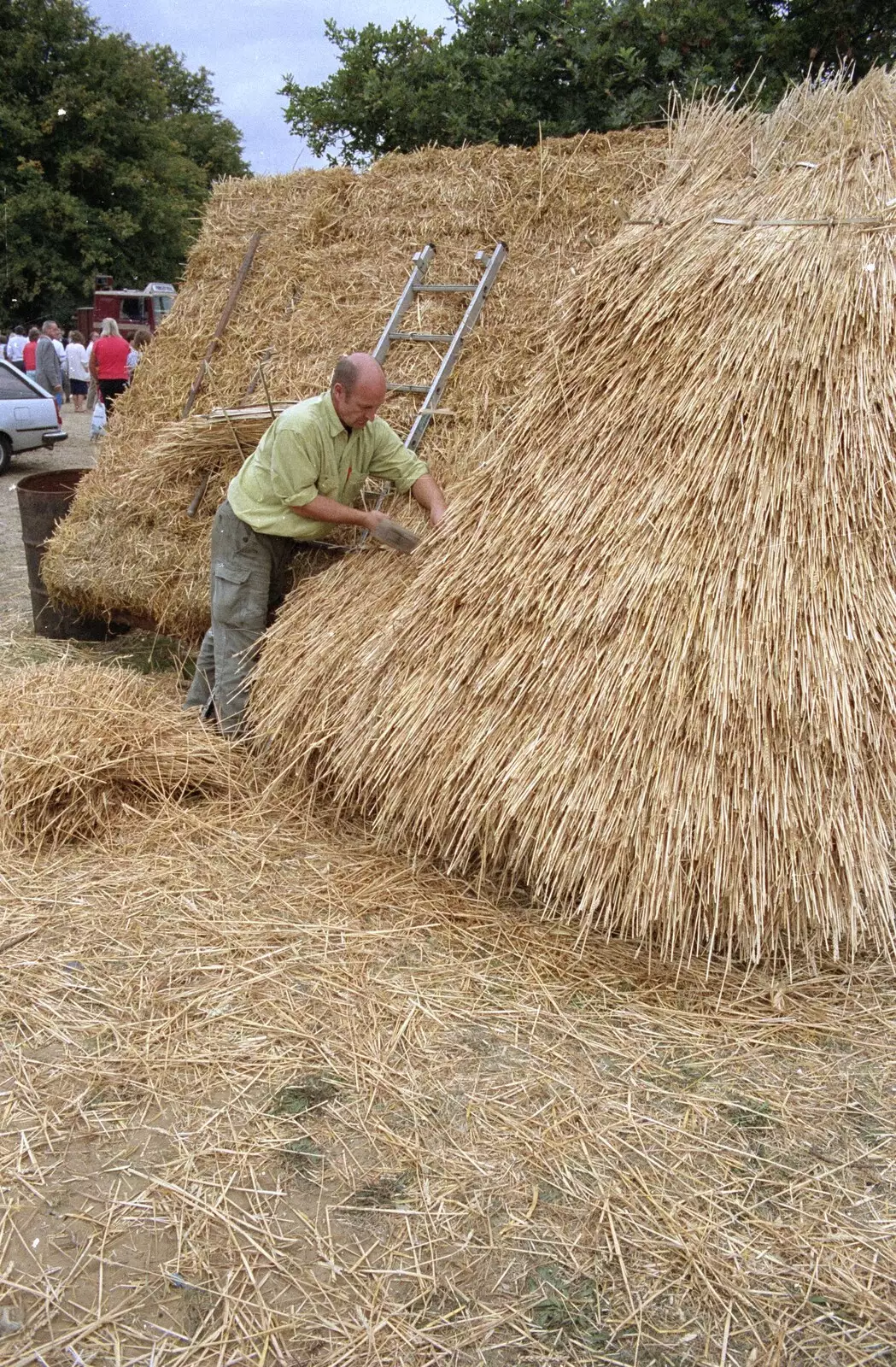 Someone gives a thatching demonstration, from The Henham Steam Fair, Henham, Suffolk - 19th September 1990