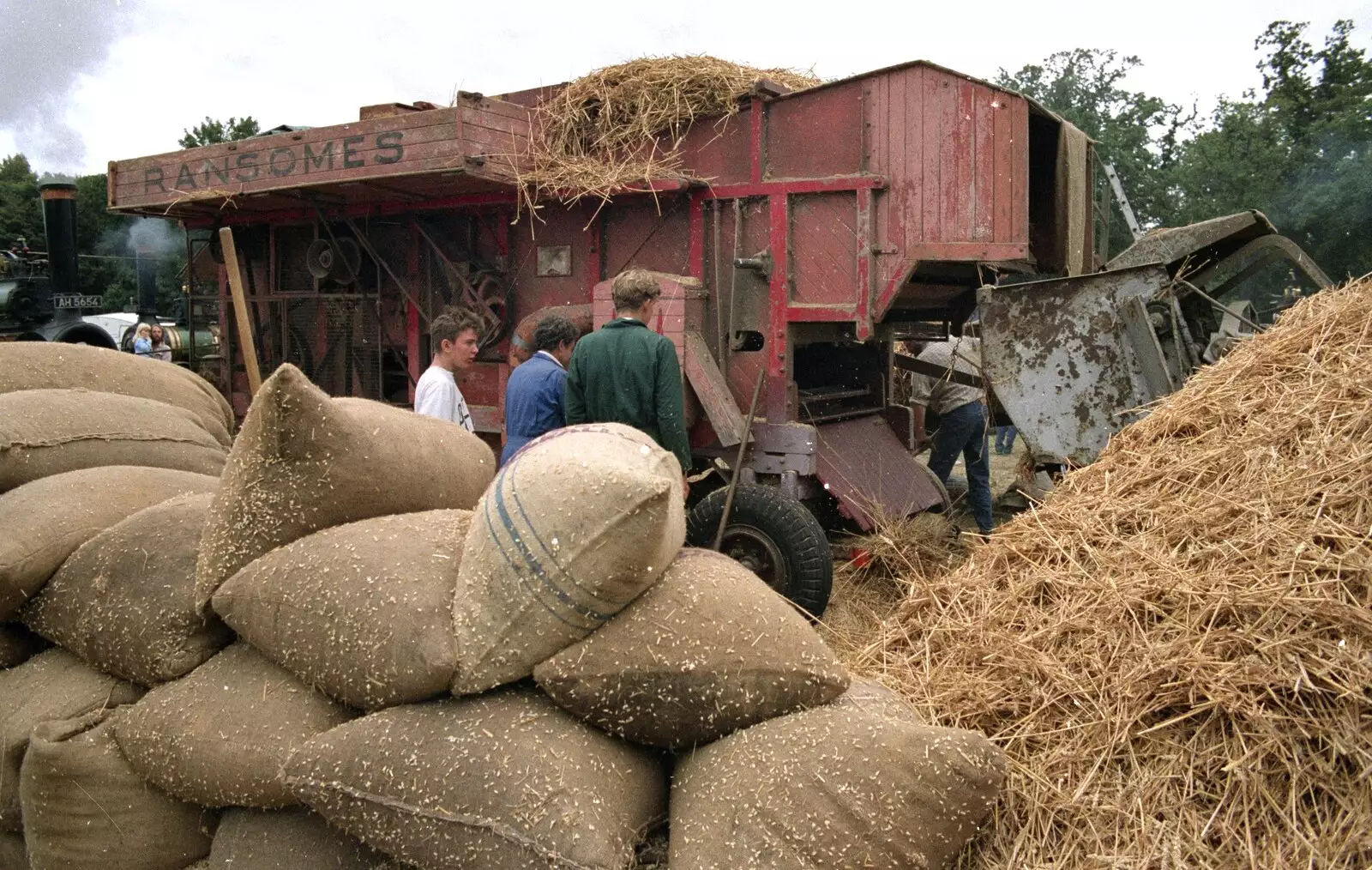 Sacks of wheat sit by the thresher, from The Henham Steam Fair, Henham, Suffolk - 19th September 1990