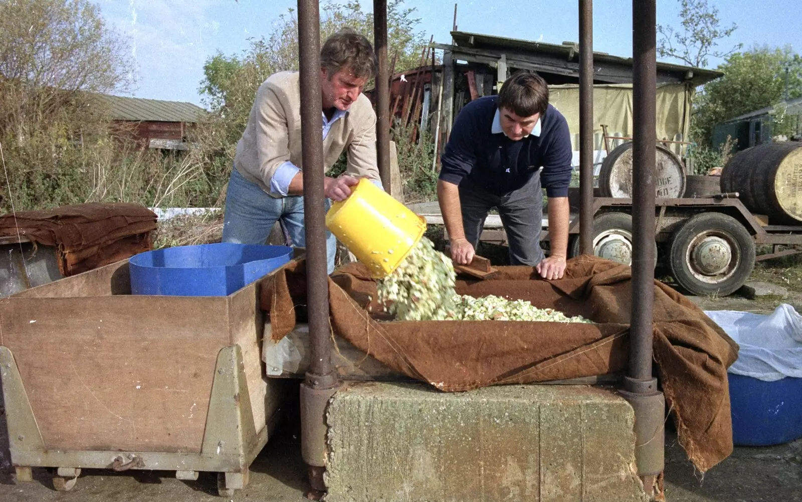 Geoff and Corky lay down the first cheese, from The Annual Cider Making Event, Stuston, Suffolk - 11th October 1990