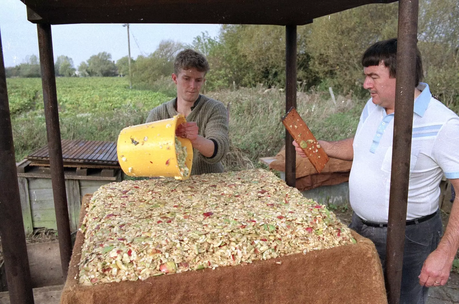 Corky pats down a perfect cheese, from The Annual Cider Making Event, Stuston, Suffolk - 11th October 1990