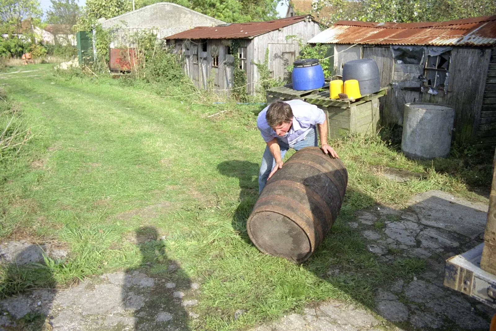 Geoff rolls out a barrel, from The Annual Cider Making Event, Stuston, Suffolk - 11th October 1990