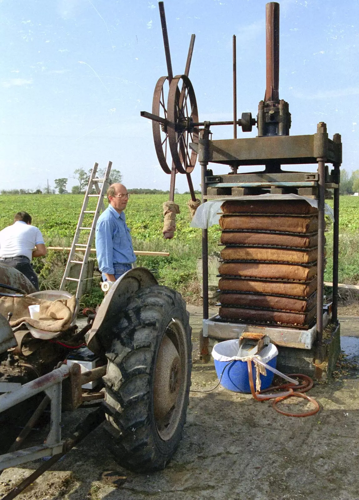 John Chapman inspects the stack of cheeses, from The Annual Cider Making Event, Stuston, Suffolk - 11th October 1990