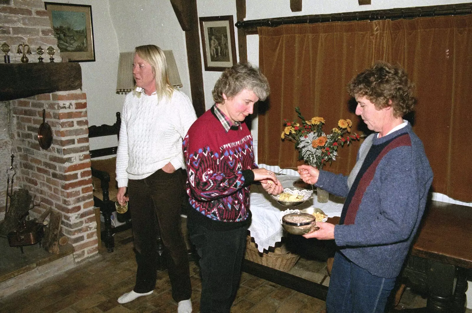 Linda grabs a crisp, from Bonfire Night, Stuston, Suffolk - 5th November 1990