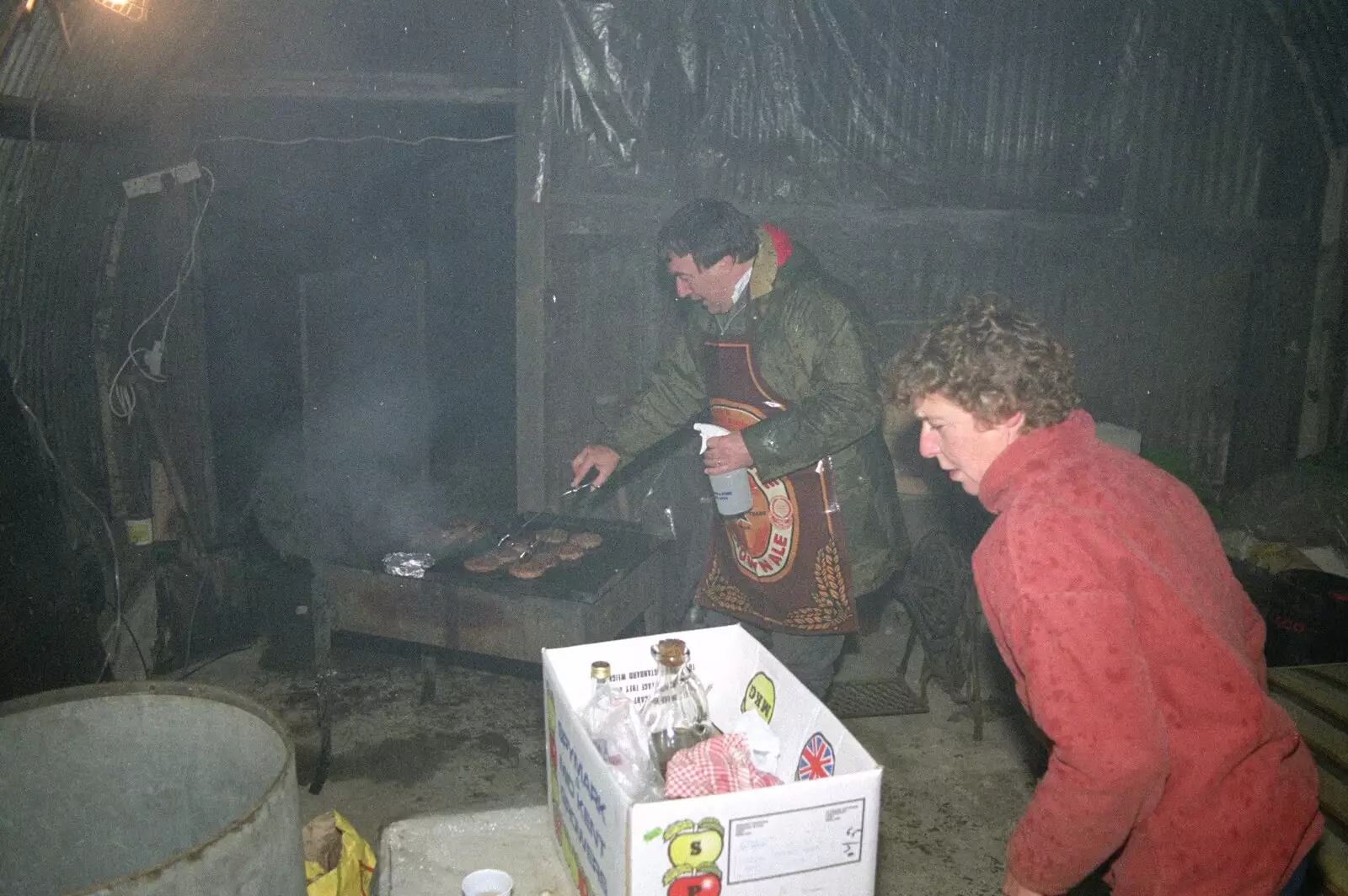 Corky takes over on barbeque duty, from Bonfire Night, Stuston, Suffolk - 5th November 1990