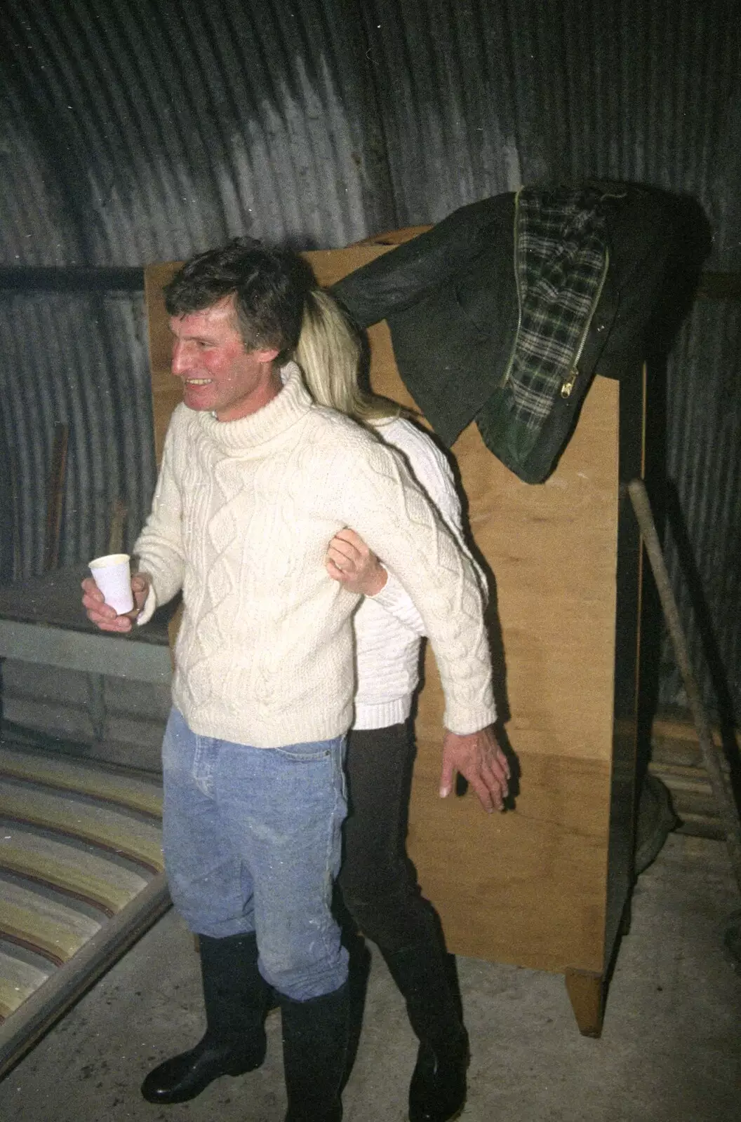 Mad Sue hides behind Geoff's Arran jumper, from Bonfire Night, Stuston, Suffolk - 5th November 1990