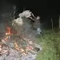 Geoff chucks some more fuel on to the fire, Bonfire Night, Stuston, Suffolk - 5th November 1990