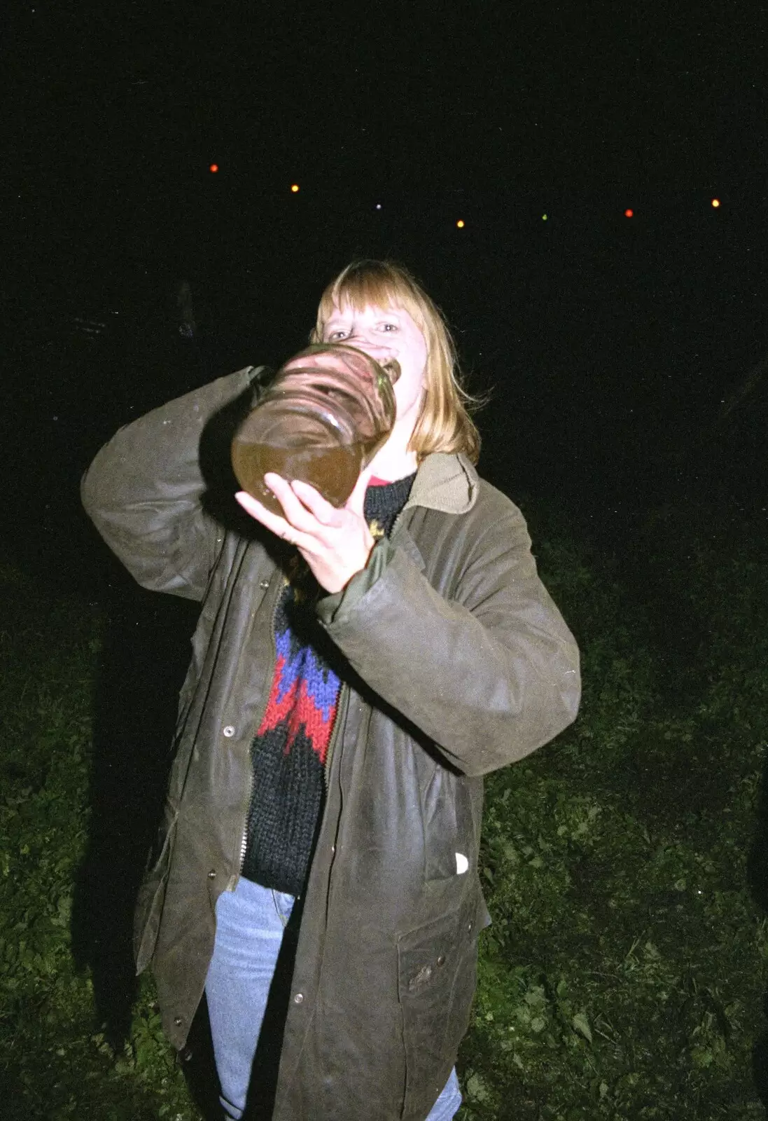 Janet has a swig from a demijohn of cider, from Bonfire Night, Stuston, Suffolk - 5th November 1990