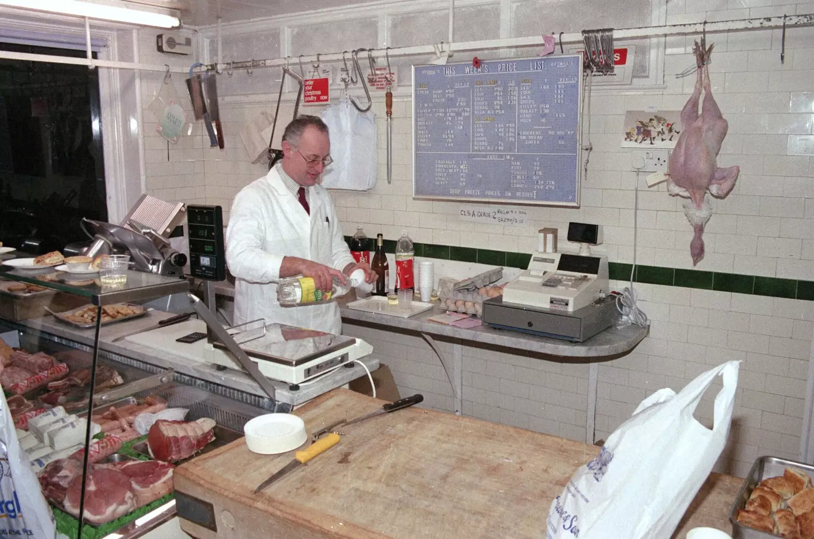 Roger Browne pours out some lemonade, from Carol Singing and Late Night Shopping, Stuston, Diss and Harleston, Norfolk - 16th December 1990