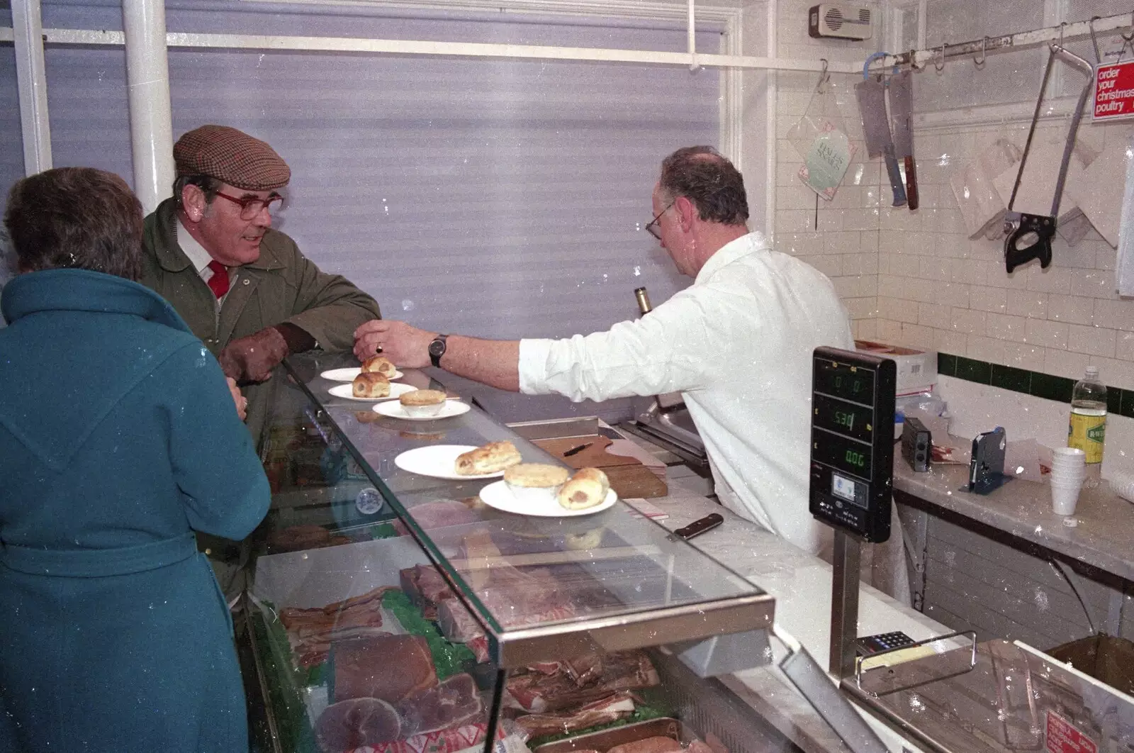 Roger hands out sausage rolls, from Carol Singing and Late Night Shopping, Stuston, Diss and Harleston, Norfolk - 16th December 1990