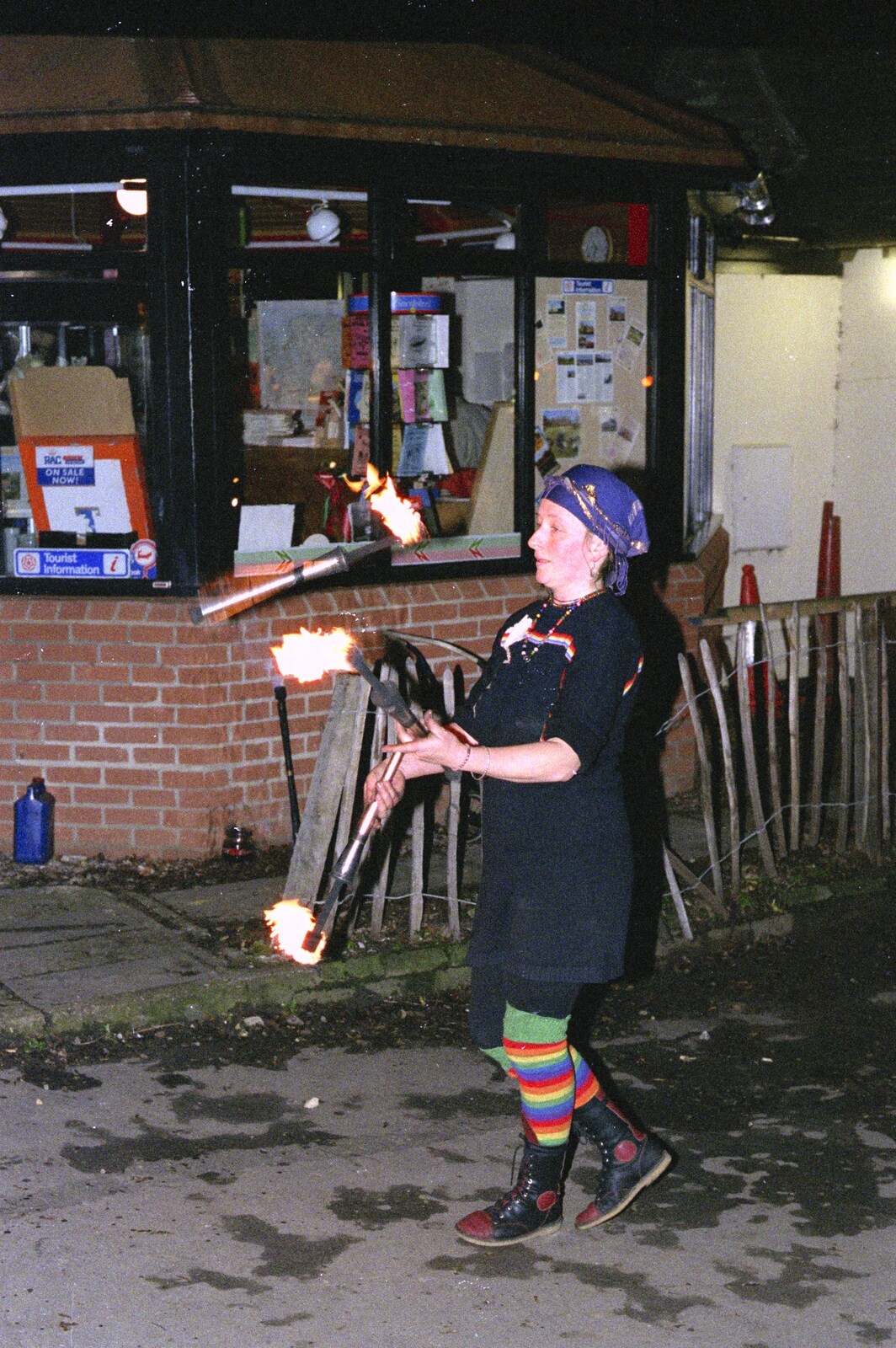 There's a fire juggler by the tourist office from Carol Singing and Late Night Shopping, Stuston, Diss and Harleston, Norfolk - 16th December 1990