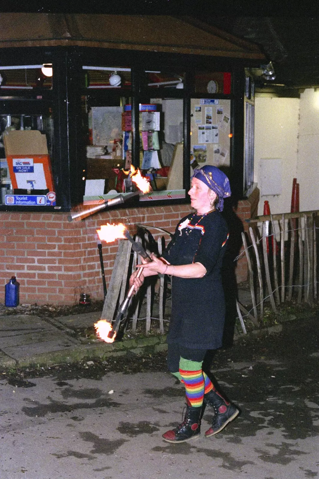 There's a fire juggler by the tourist office, from Carol Singing and Late Night Shopping, Stuston, Diss and Harleston, Norfolk - 16th December 1990