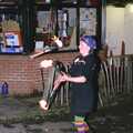 There's a fire juggler by the tourist office, Carol Singing and Late Night Shopping, Stuston, Diss and Harleston, Norfolk - 16th December 1990