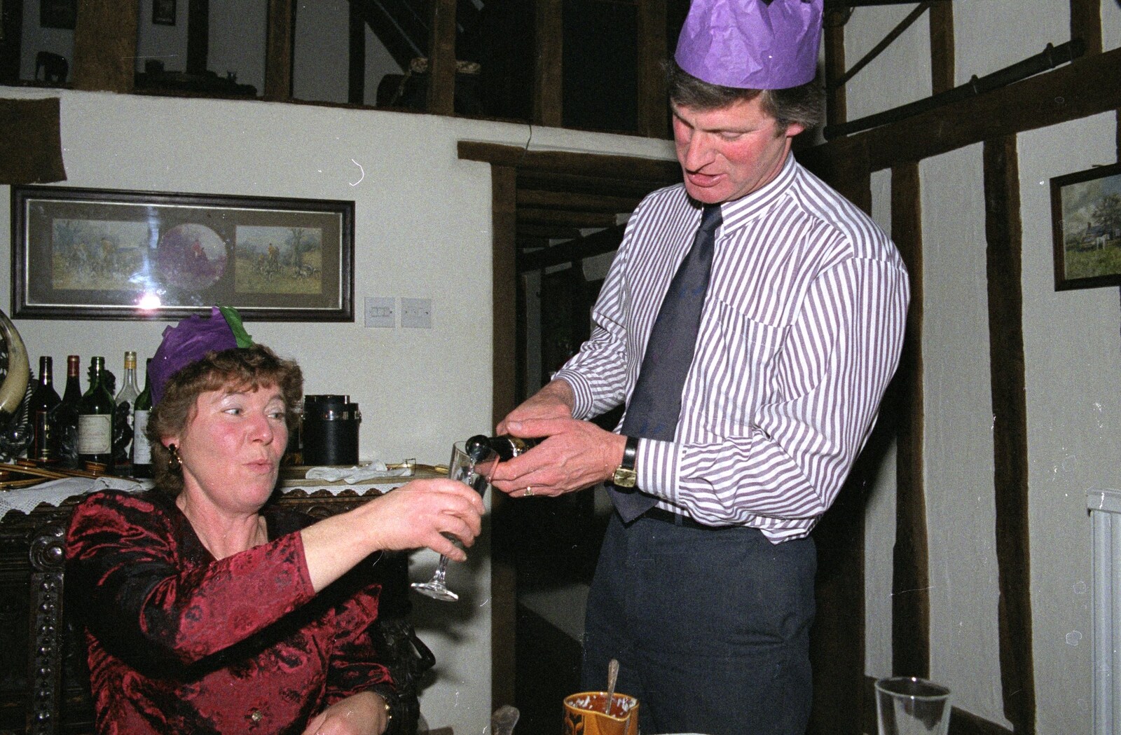Geoff pours out some fizz from Christmas Dinner with Geoff and Brenda, Stuston, Suffolk - 25th December 1990