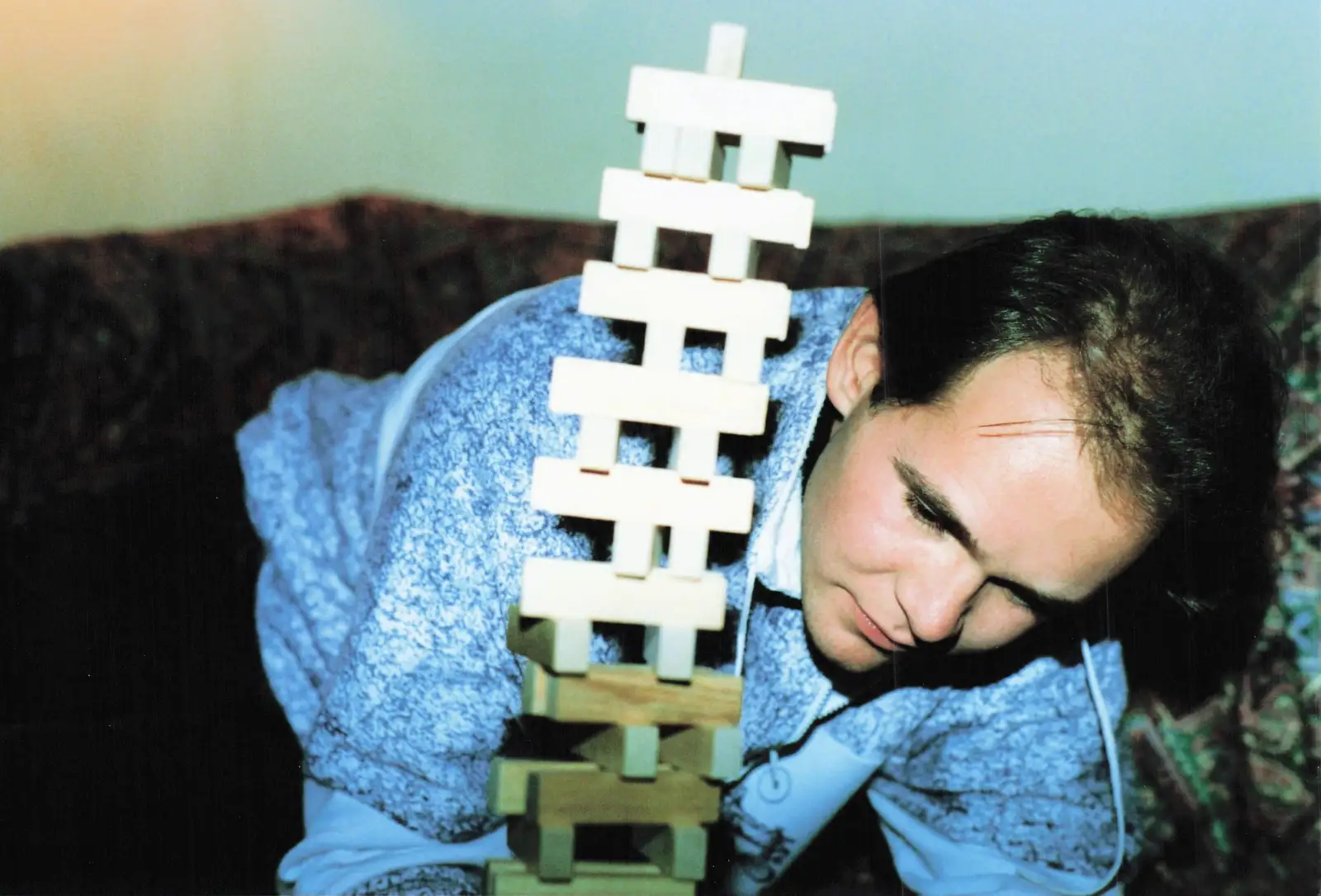 Phil by a toppling Jenga stack, from New Year's Eve at Phil's, Hordle, Hampshire - 31st December 1990