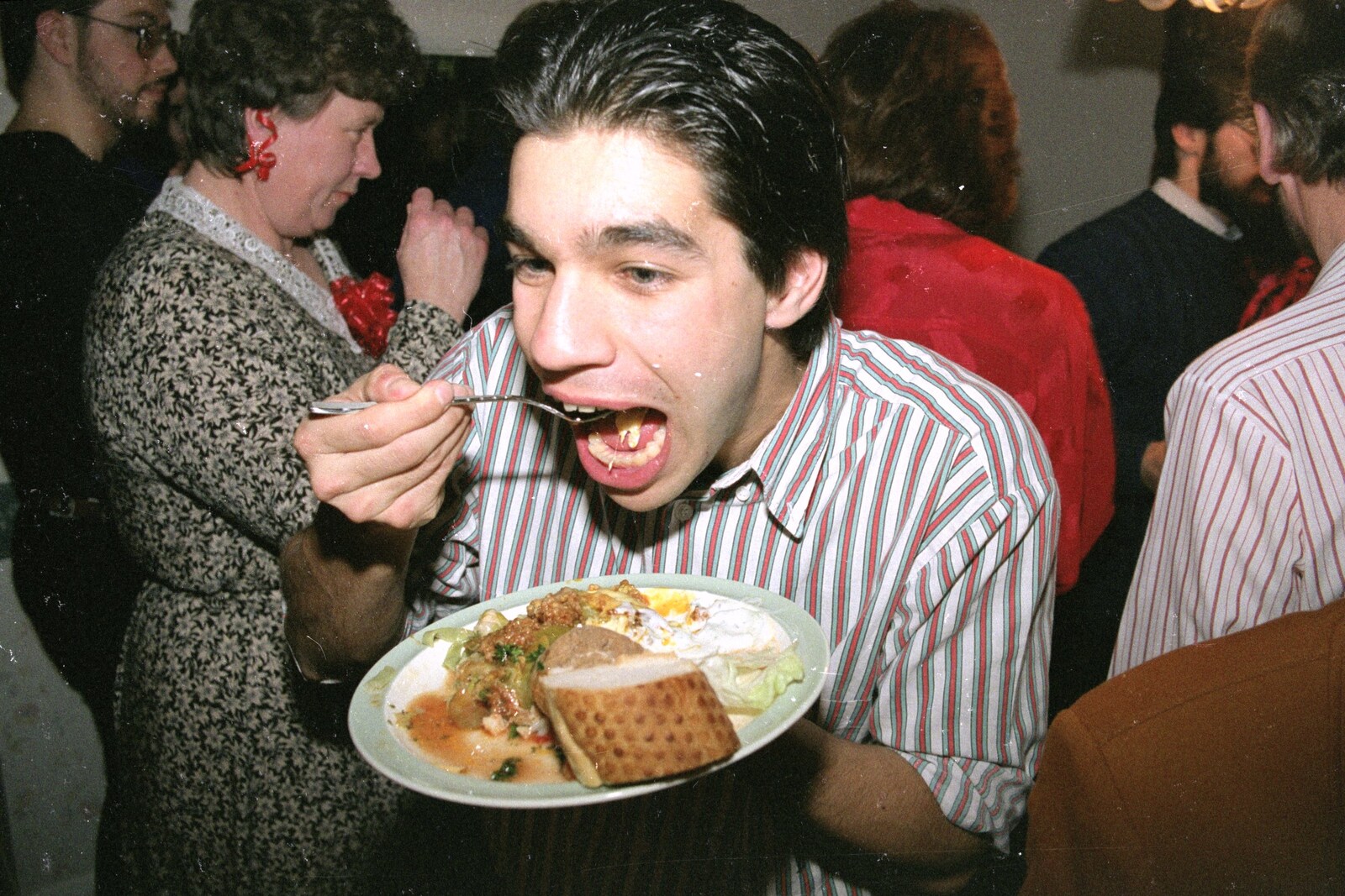 Nigel tucks in to some grub from New Year's Eve at Phil's, Hordle, Hampshire - 31st December 1990