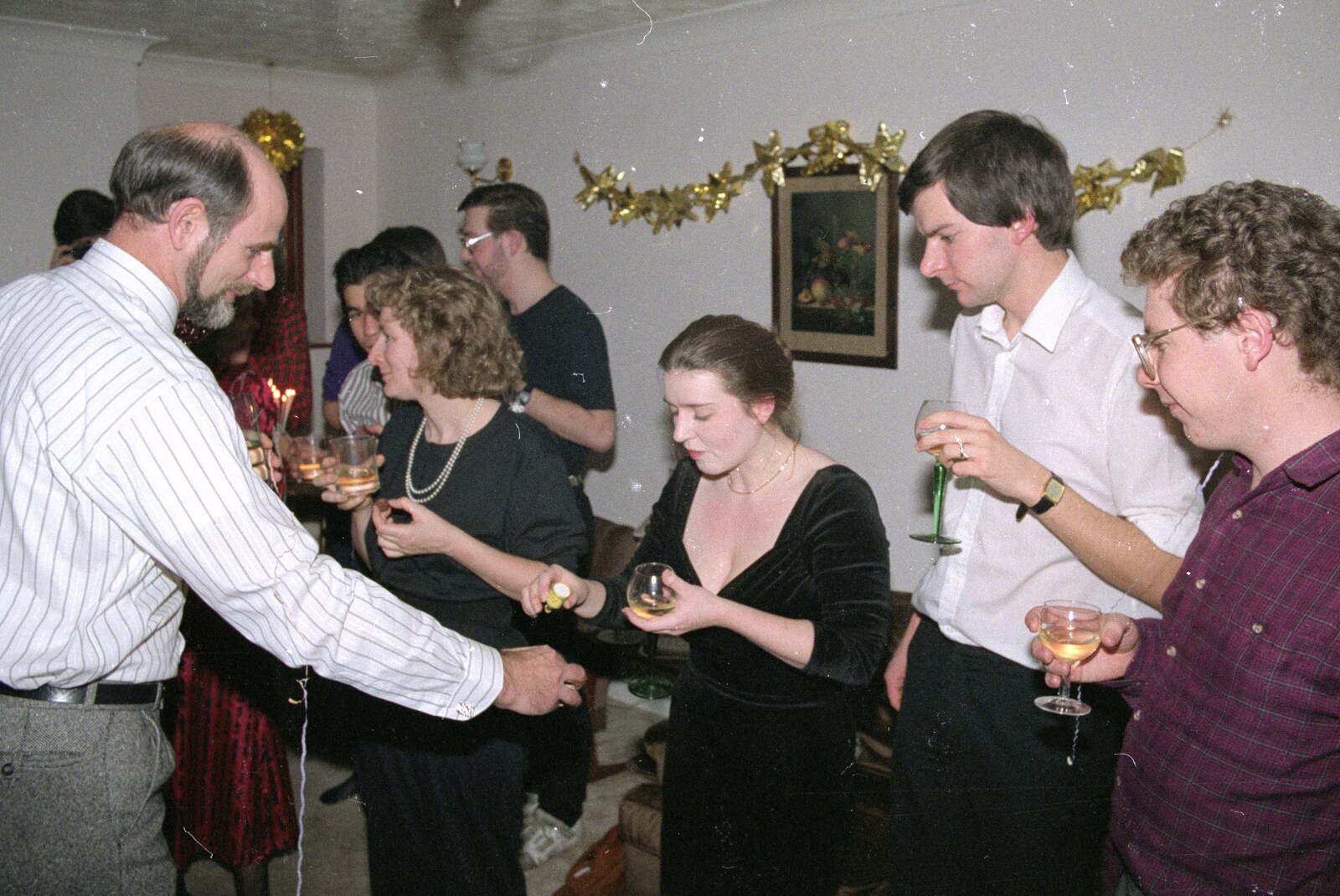 Something is handed out from New Year's Eve at Phil's, Hordle, Hampshire - 31st December 1990