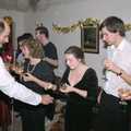 Something is handed out, New Year's Eve at Phil's, Hordle, Hampshire - 31st December 1990