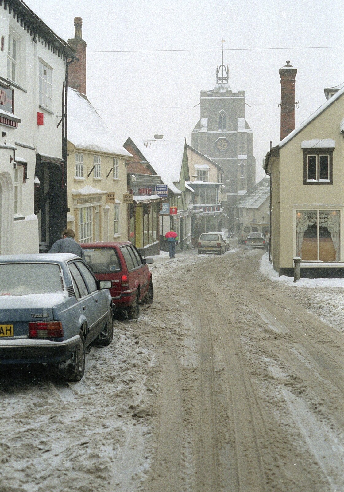 Cars in the snow on St. Nicholas Street from Sledging on the Common and Some Music, Stuston, Suffolk - 5th February 1991