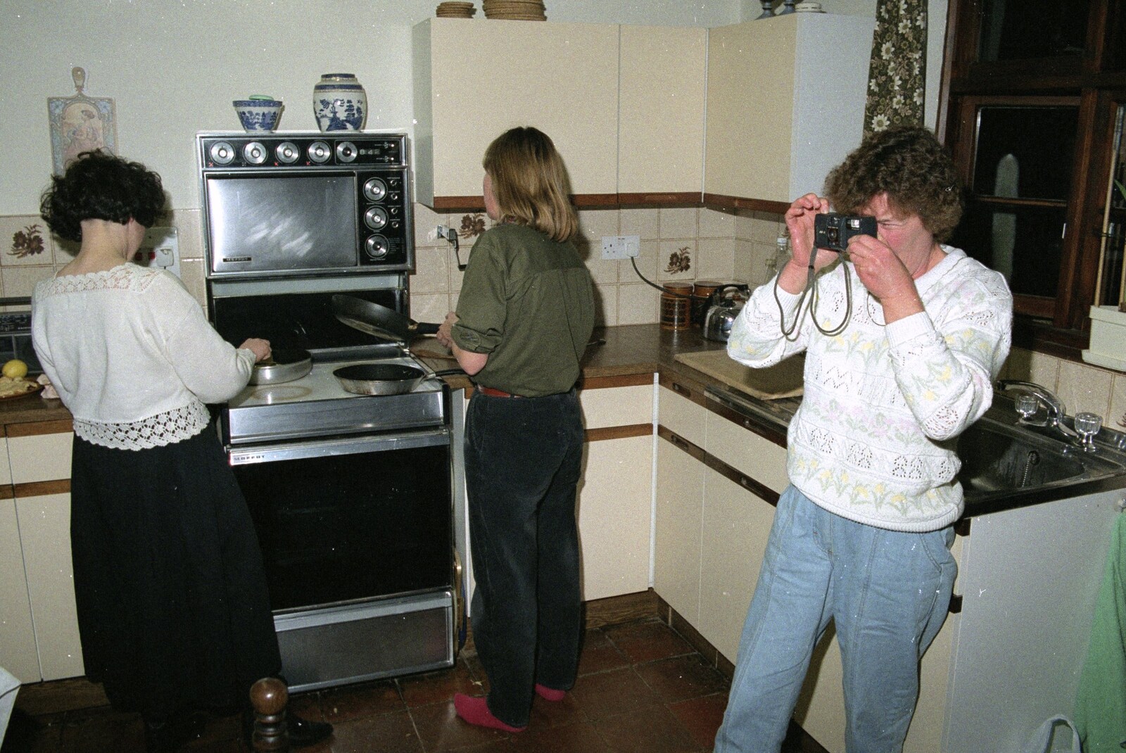 Brenda takes a photo from Pancake Day, Stuston, Suffolk - 18th February 1991
