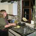 Janet flips her pancake, Pancake Day, Stuston, Suffolk - 18th February 1991