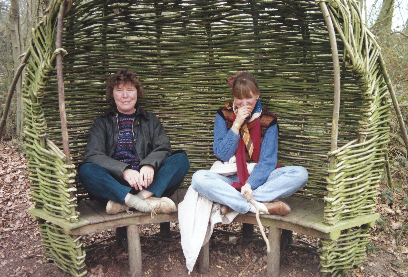 Brenda and Janet perch like elves from A Walk in Tyrrel's Wood, Pulham St. Mary, Norfolk - 23rd February 1991
