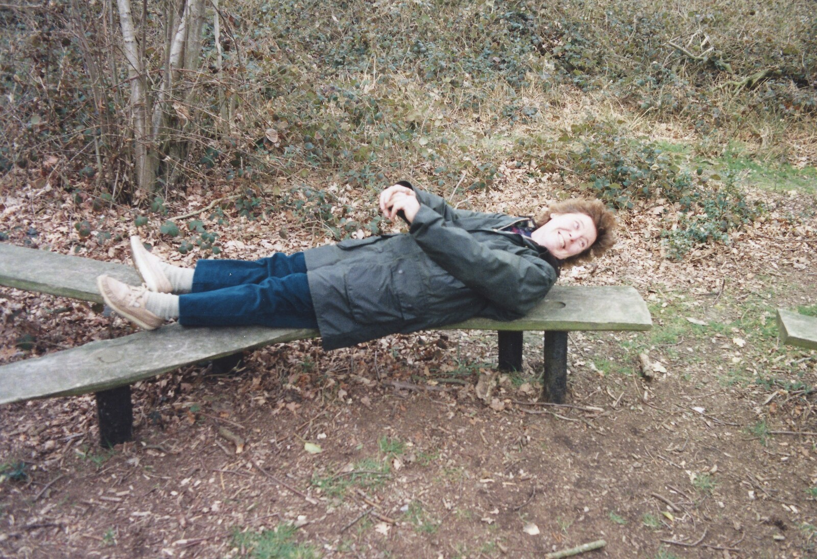Brenda lies down on a y-shaped bench from A Walk in Tyrrel's Wood, Pulham St. Mary, Norfolk - 23rd February 1991