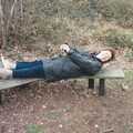 Brenda lies down on a y-shaped bench, A Walk in Tyrrel's Wood, Pulham St. Mary, Norfolk - 23rd February 1991