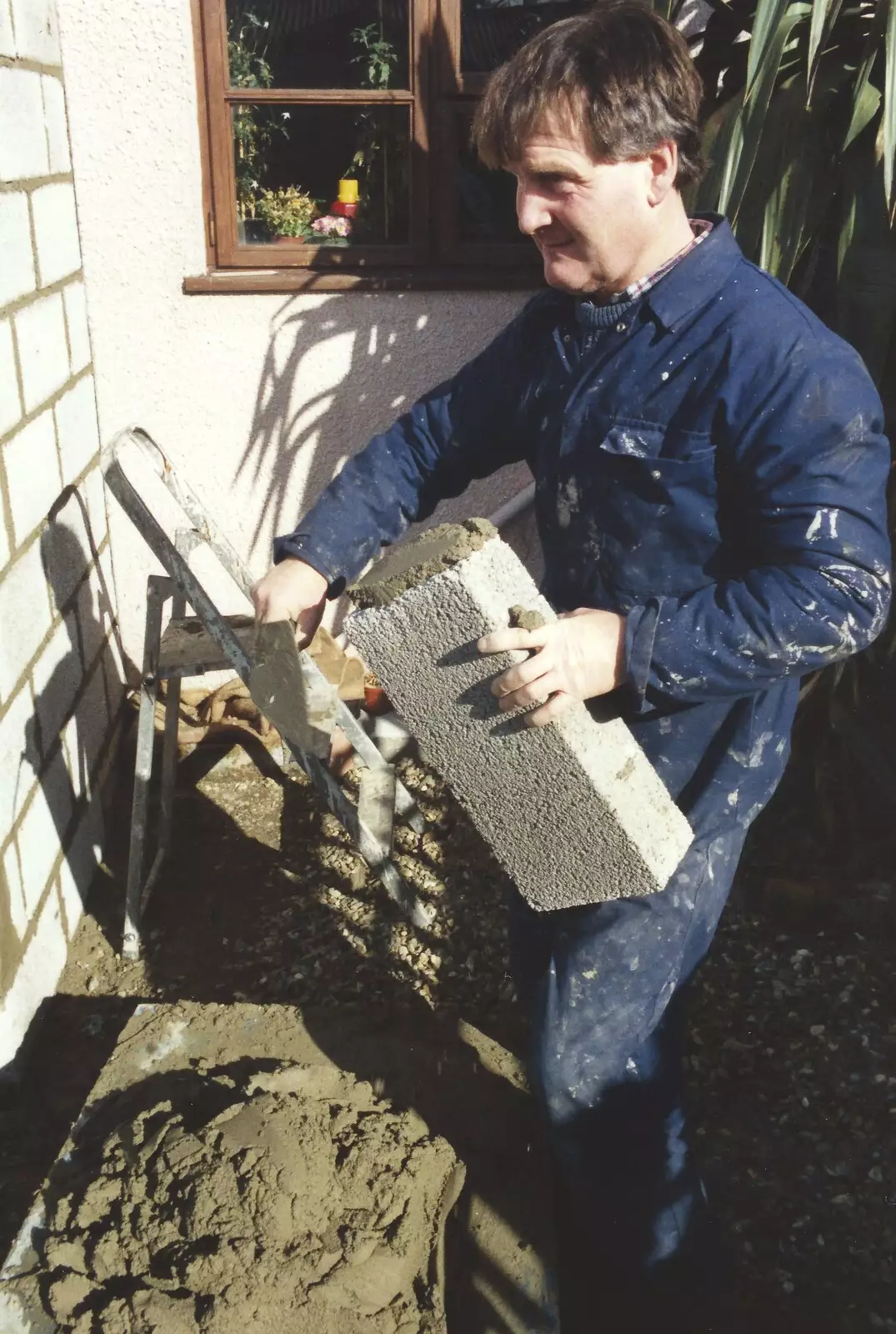 Bernie lays on some cement, from Bernie and the Porch, The Stables, Stuston, Suffolk - 15th March 1991