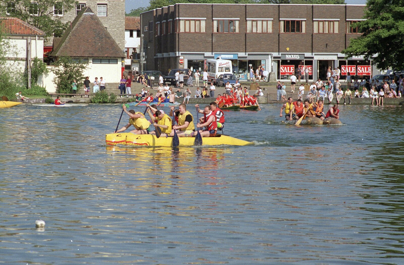 A banana/dragon boat paddles furiously from The Diss Raft Race, Diss Mere, Norfolk - 6th July 1991