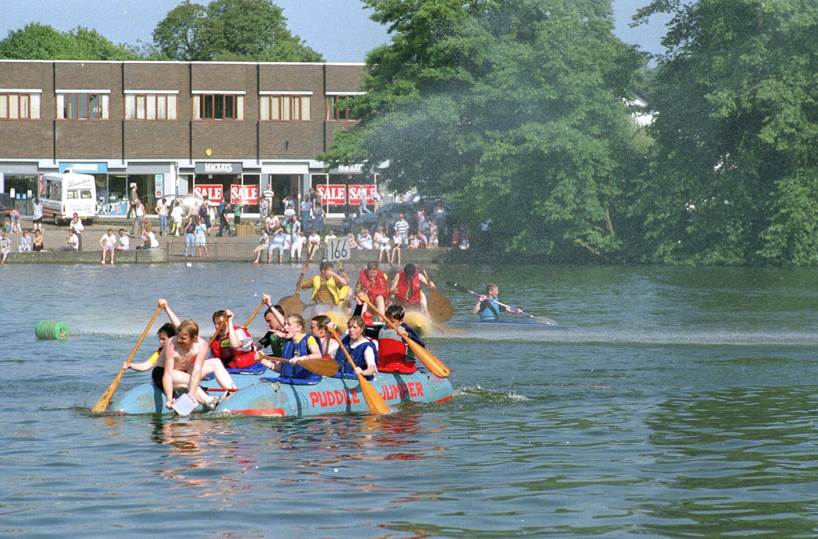 A firehose sprays the rafts from The Diss Raft Race, Diss Mere, Norfolk - 6th July 1991