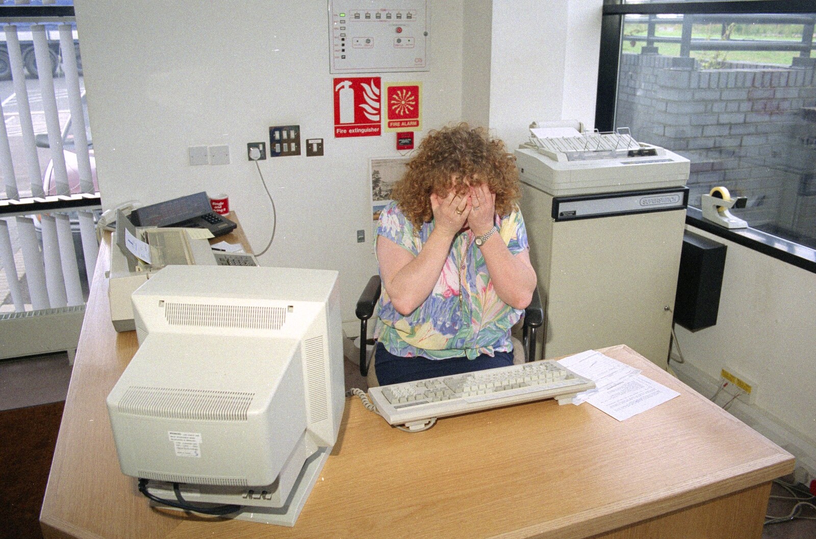 The receptionist hides from Nosher Leaves BPCC Business Magazines, Colchester, Essex - 18th July 1991