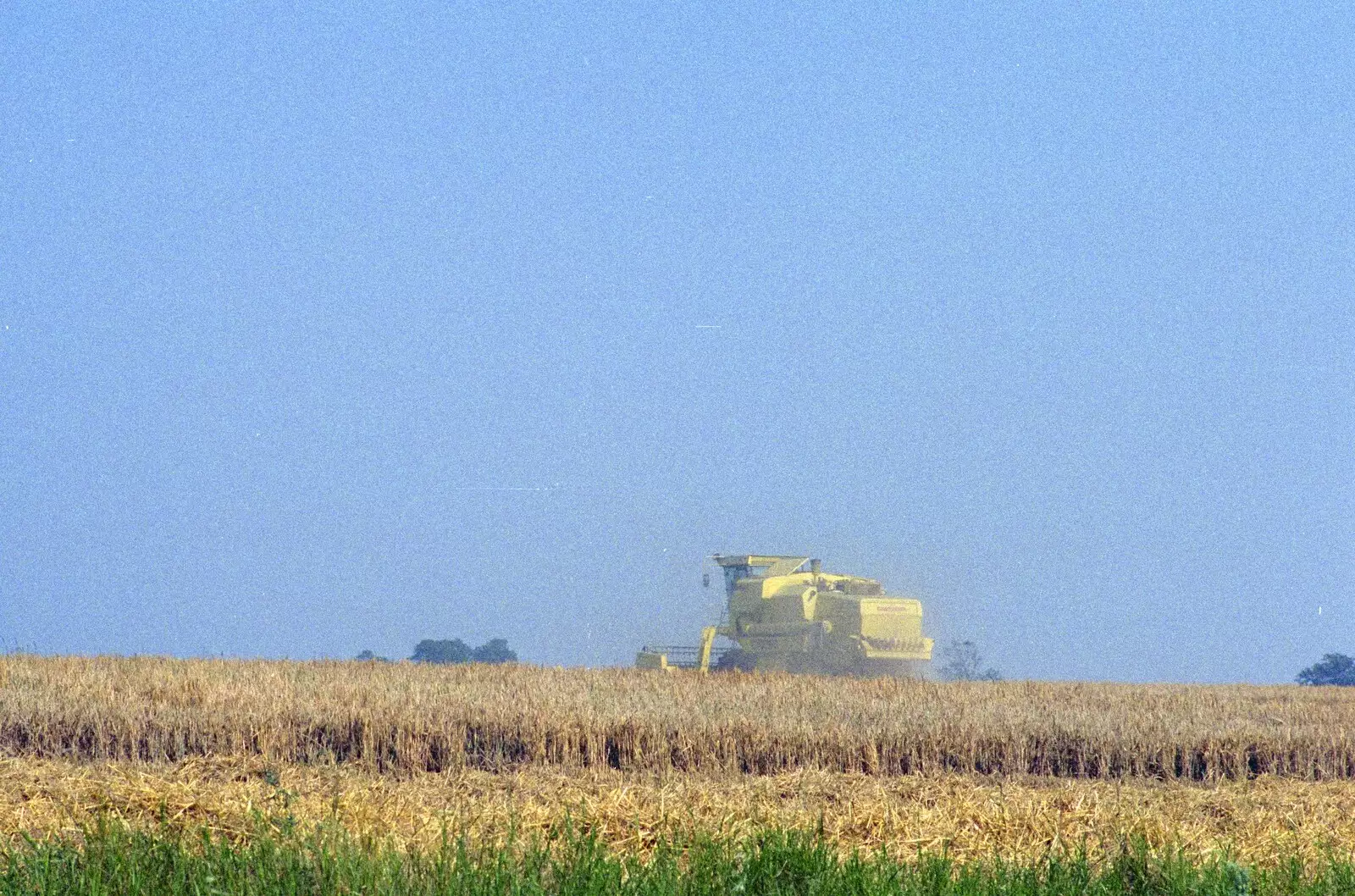 A combine harvester does its thing, from Nosher Leaves BPCC Business Magazines, Colchester, Essex - 18th July 1991