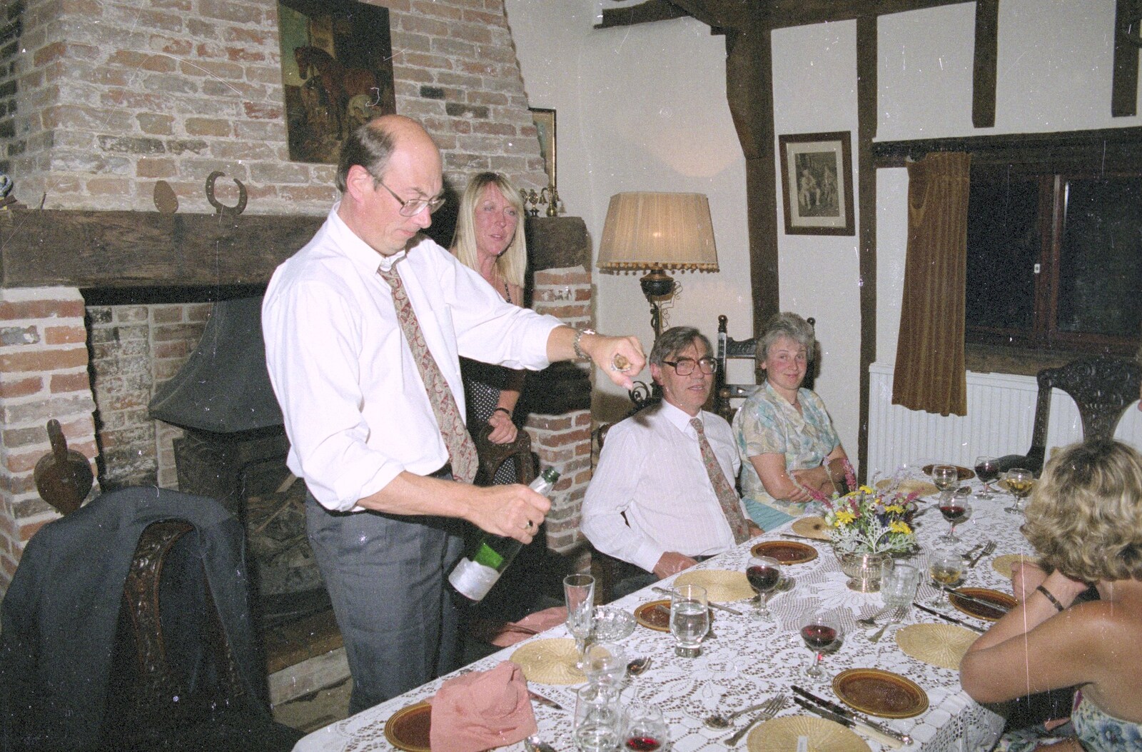 John Chapman uncorks a bottle of fizz from Nosher's Dinner Party, Stuston, Suffolk - 14th September 1991
