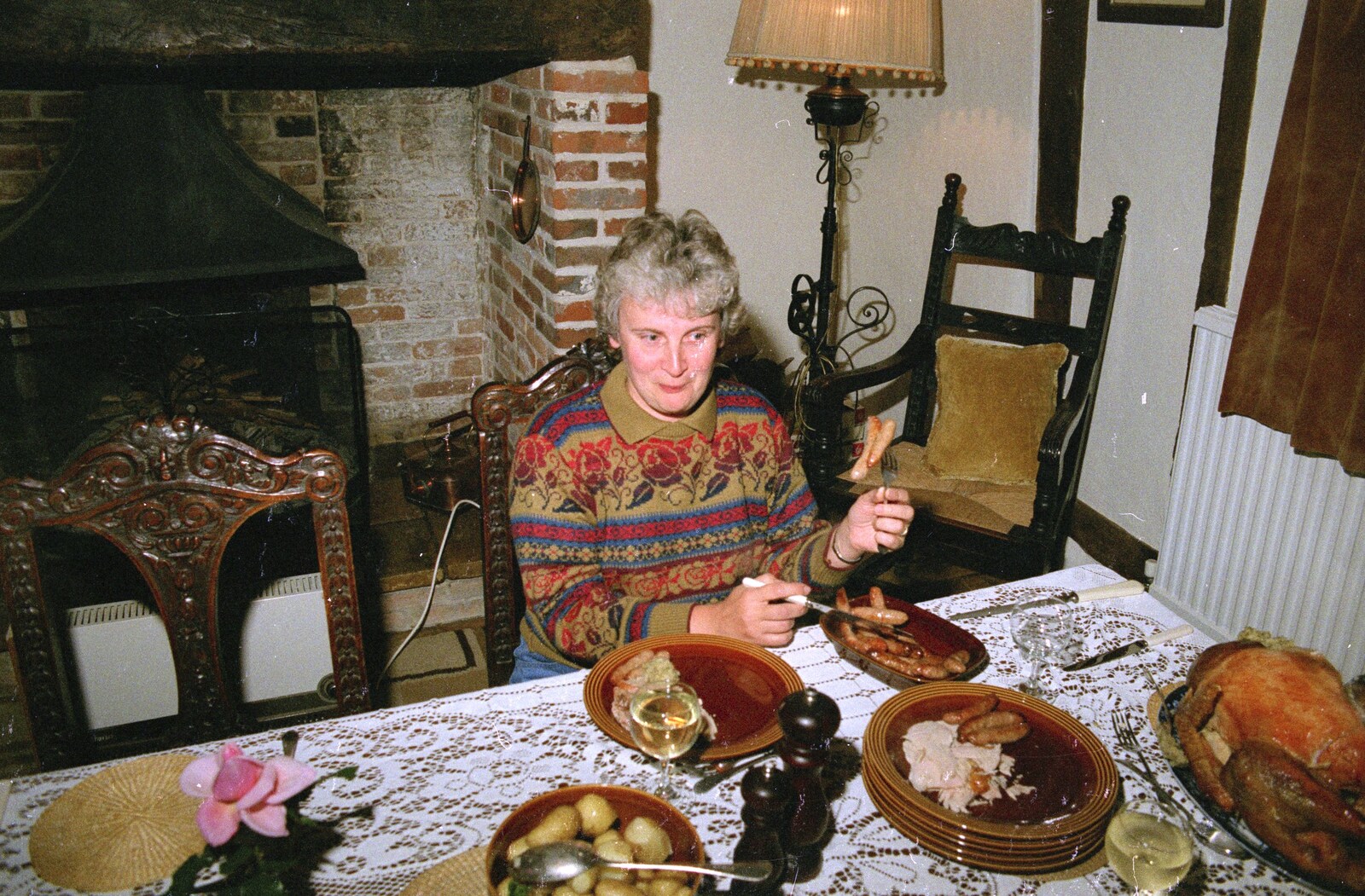 Linda pokes the chipolatas from Cider Making, Stuston, Suffolk - 14th October 1991