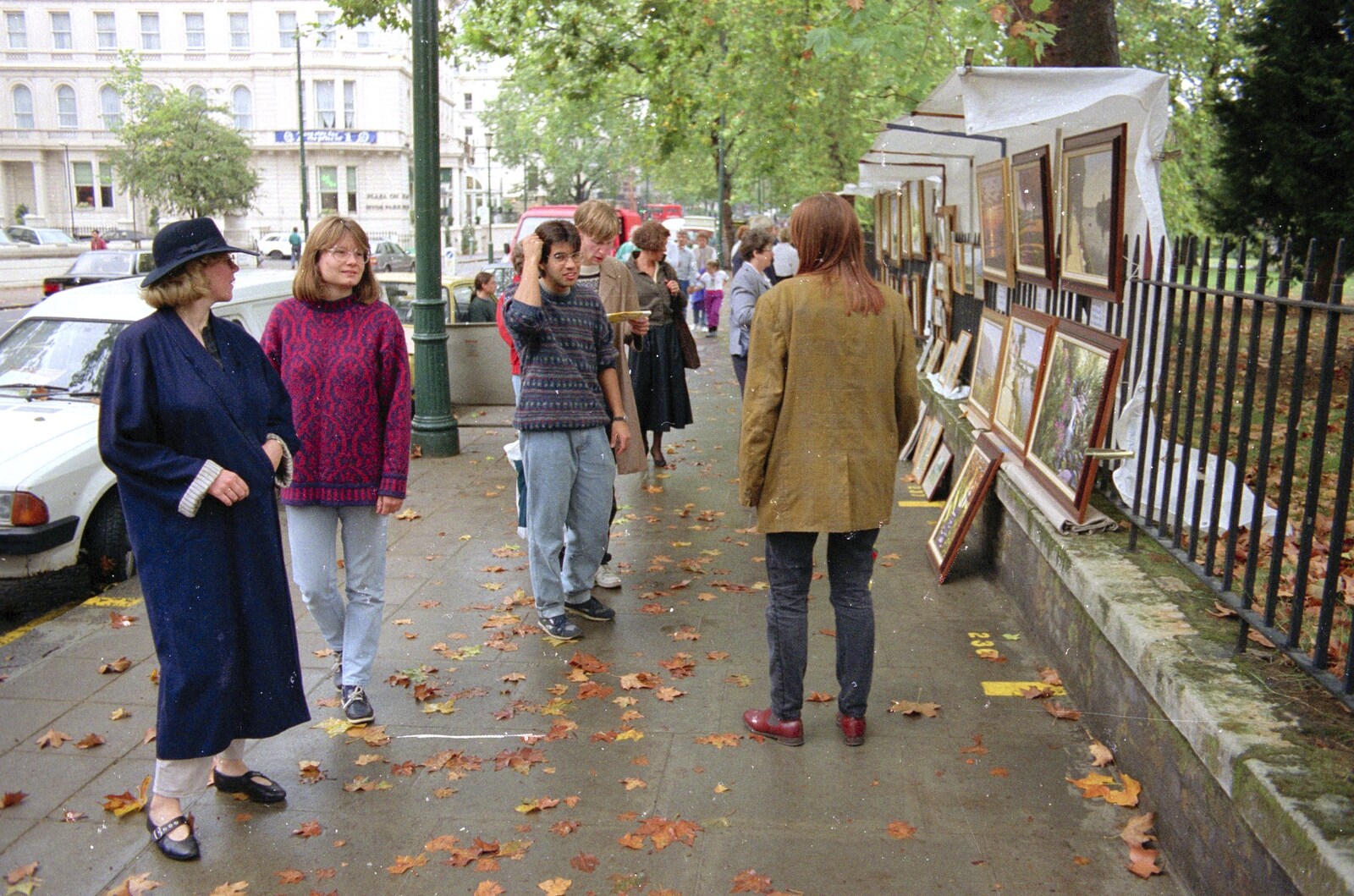 Liz and the gang inspect some paintings from Nigel's Party and Hyde Park, Lancaster Gate, London - 16th October 1991