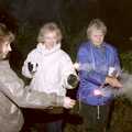 Monique, Jean and Linda do sparklers, Bonfire Night and Printec at the Stoke Ash White Horse, Suffolk - 5th November 1991