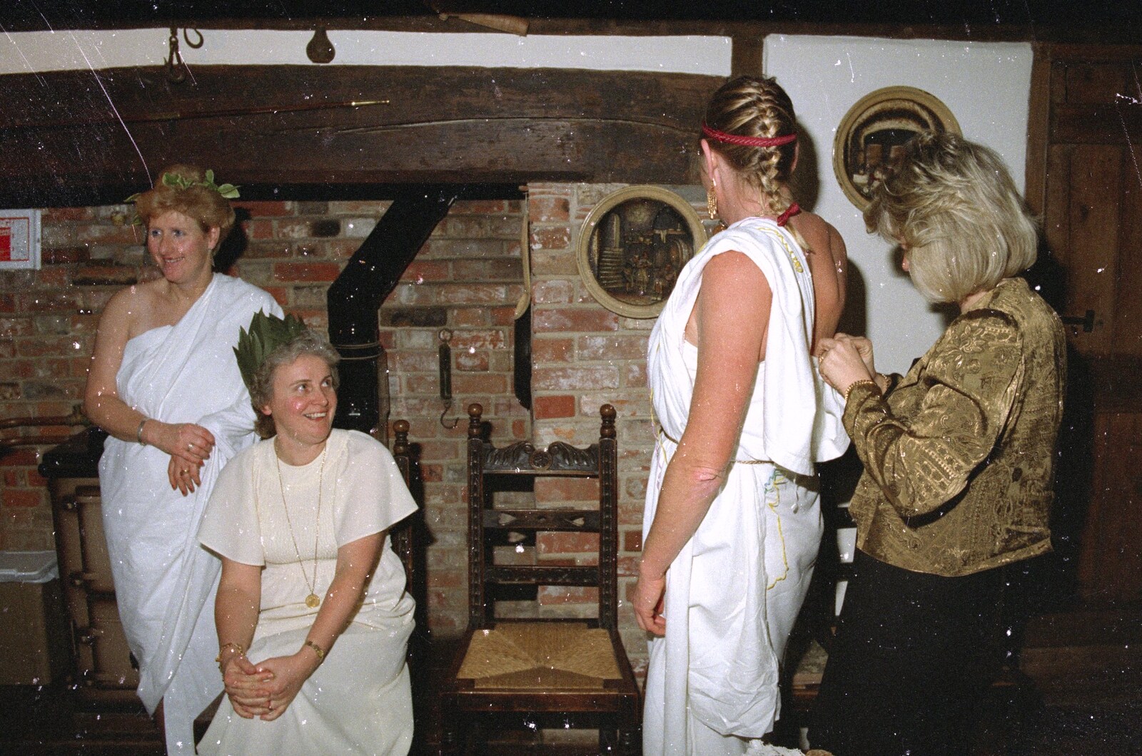 Sue gets more toga adjustment from Geoff and Brenda's Pre-Christmas Toga Party, Stuston, Suffolk - 17th December 1991