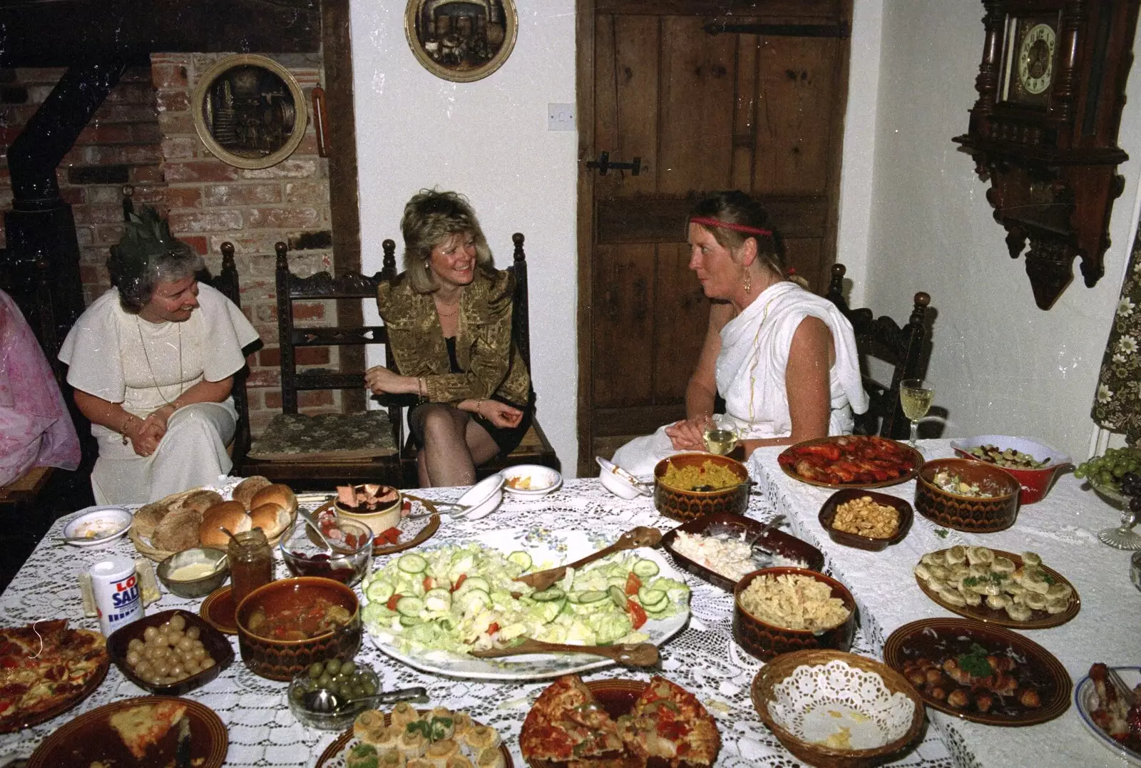 Linda, Sheila and Mad Sue chat by the food, from Geoff and Brenda's Pre-Christmas Toga Party, Stuston, Suffolk - 17th December 1991