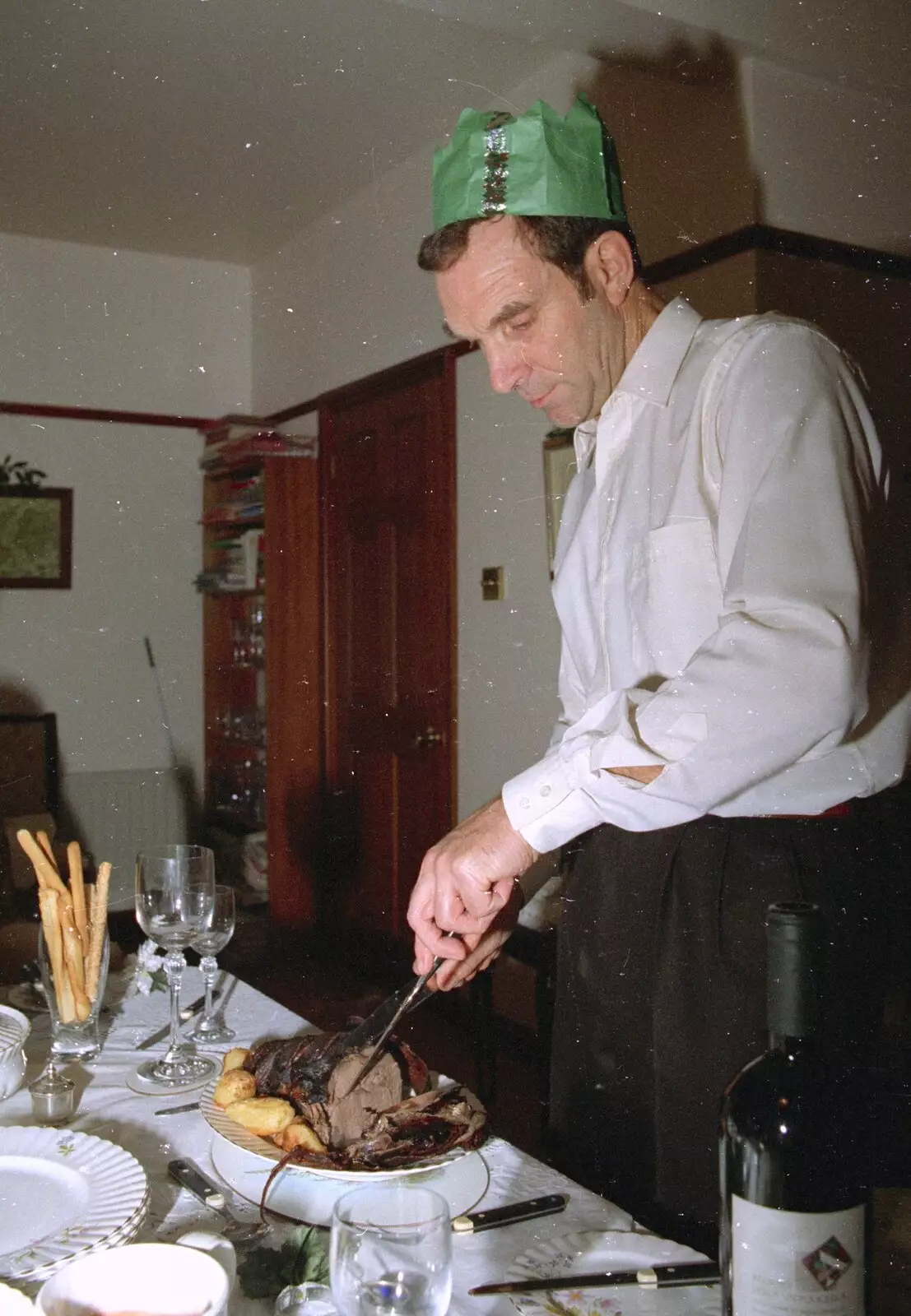 Mike carves up some meat, from Christmas in Devon and Stuston - 25th December 1991